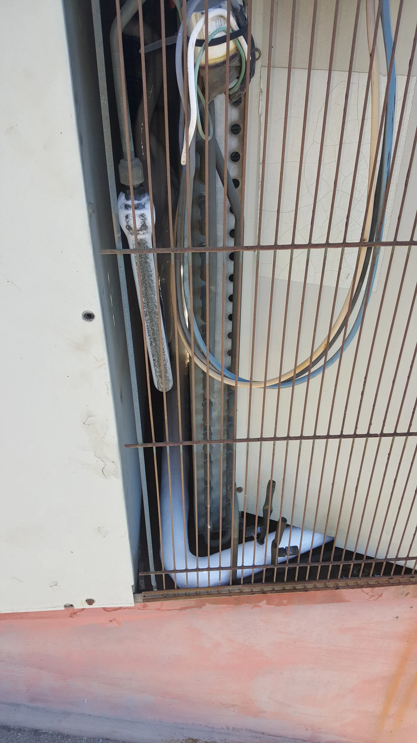 Frozen AC refrigerant line with ice buildup - common AC repair issue in Vail, Arizona