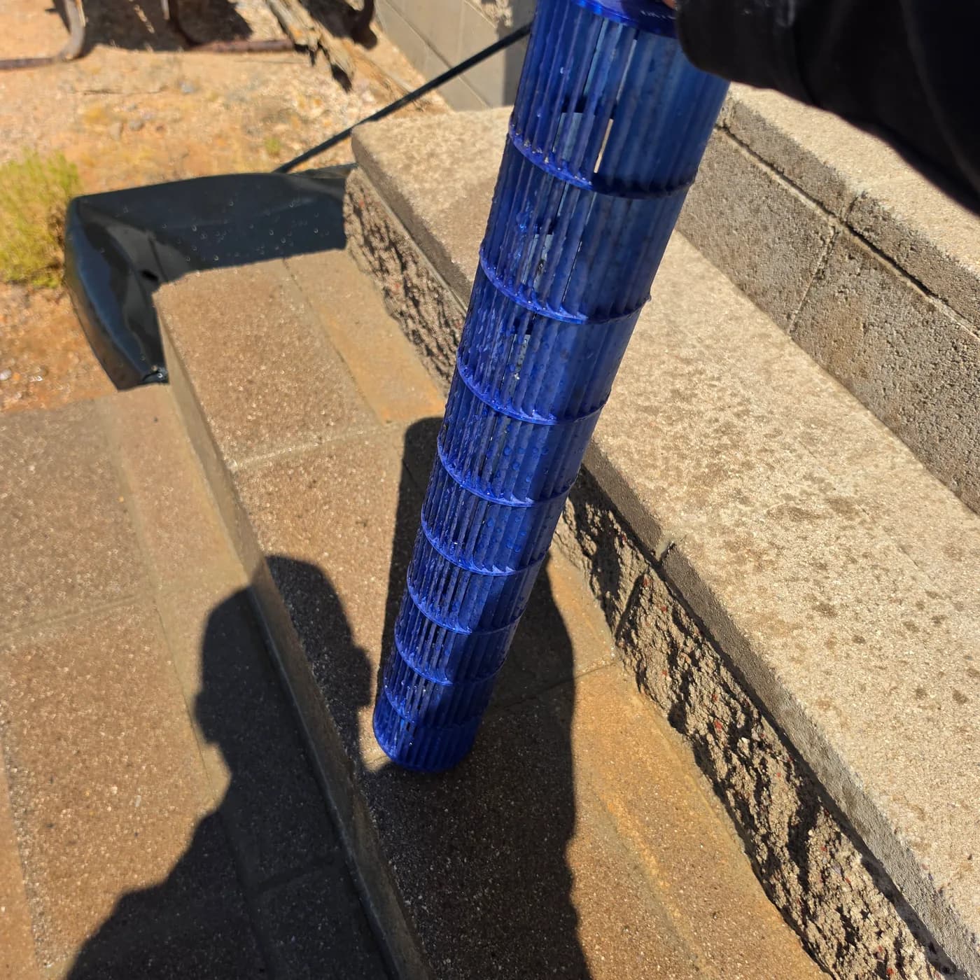 Clean ductless mini split blower wheel after professional deep cleaning showing clear blue fins