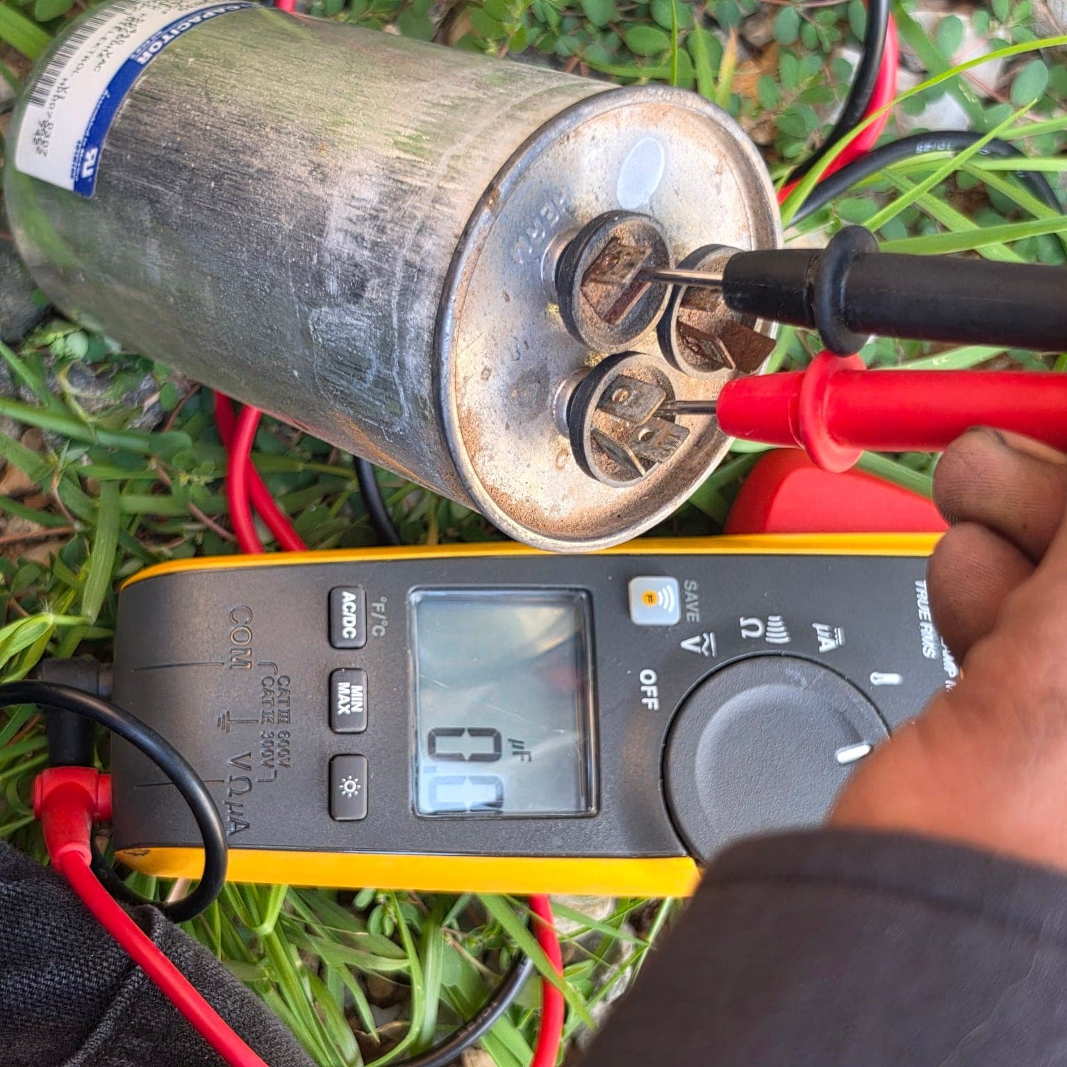 Failed air conditioner capacitor measuring zero microfarads during testing