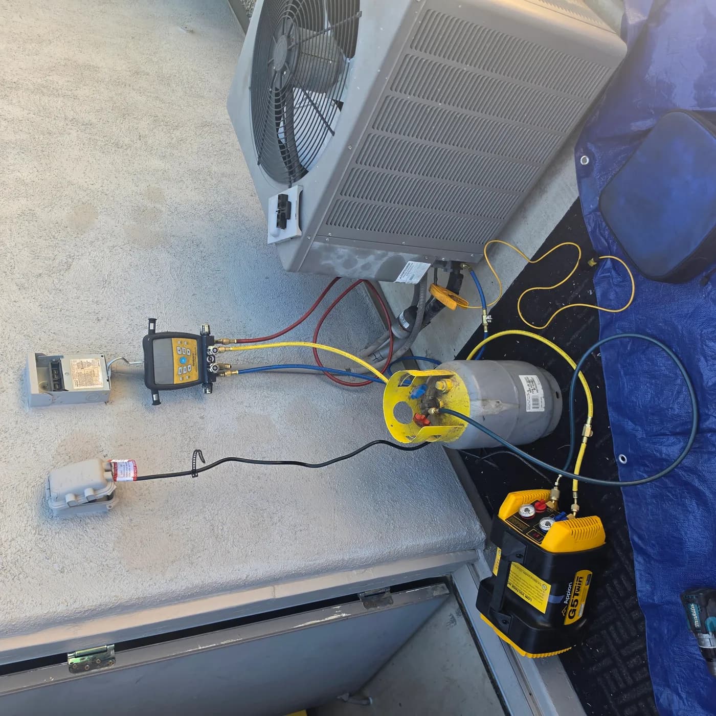 R-22 to R-407C retrofit step 1: Appion G5 Twin recovery machine and cylinder connected to the condenser recovering R-22 refrigerant in Vail AZ
