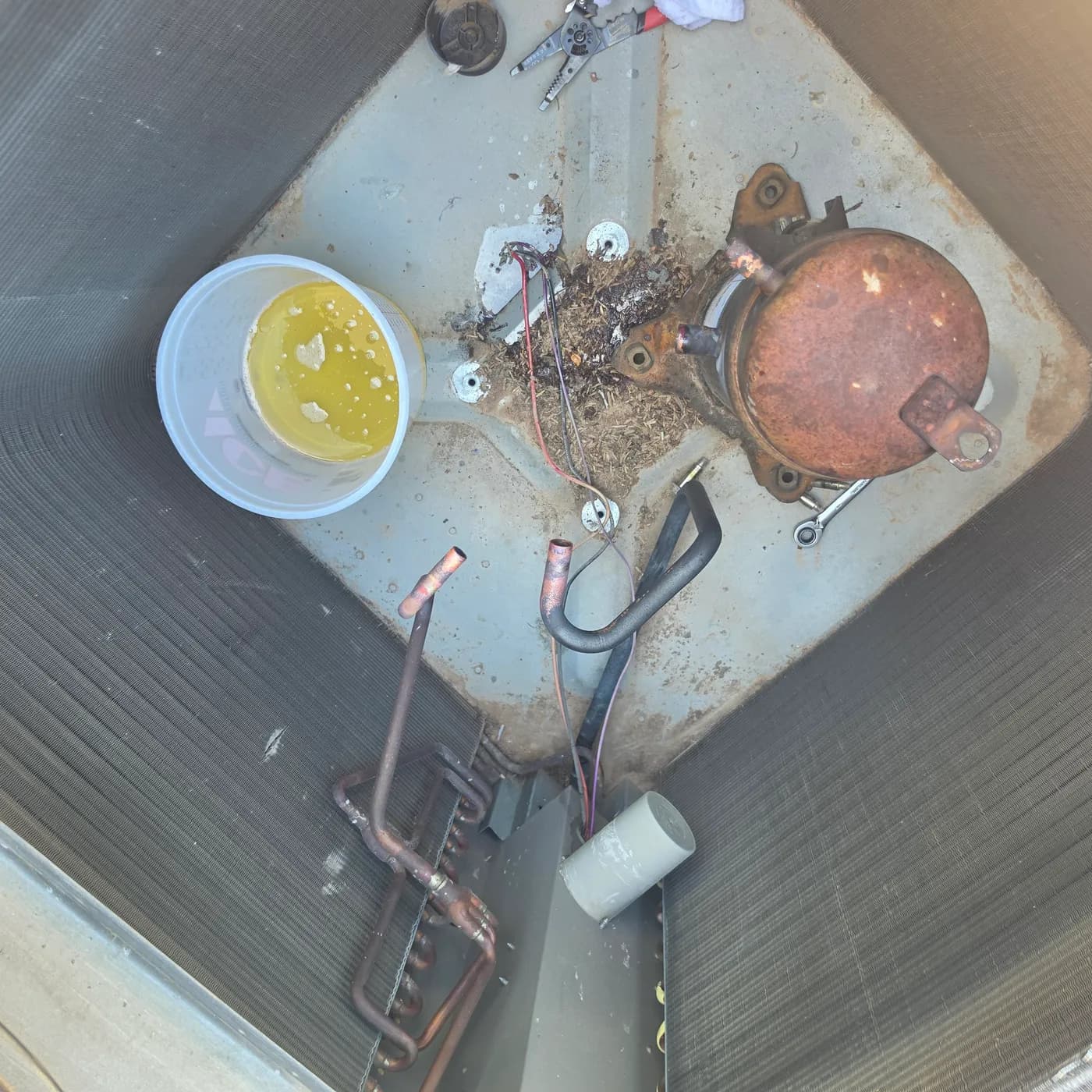 R-22 to R-407C retrofit: draining old mineral oil out of the R-22 compressor before adding new POE oil